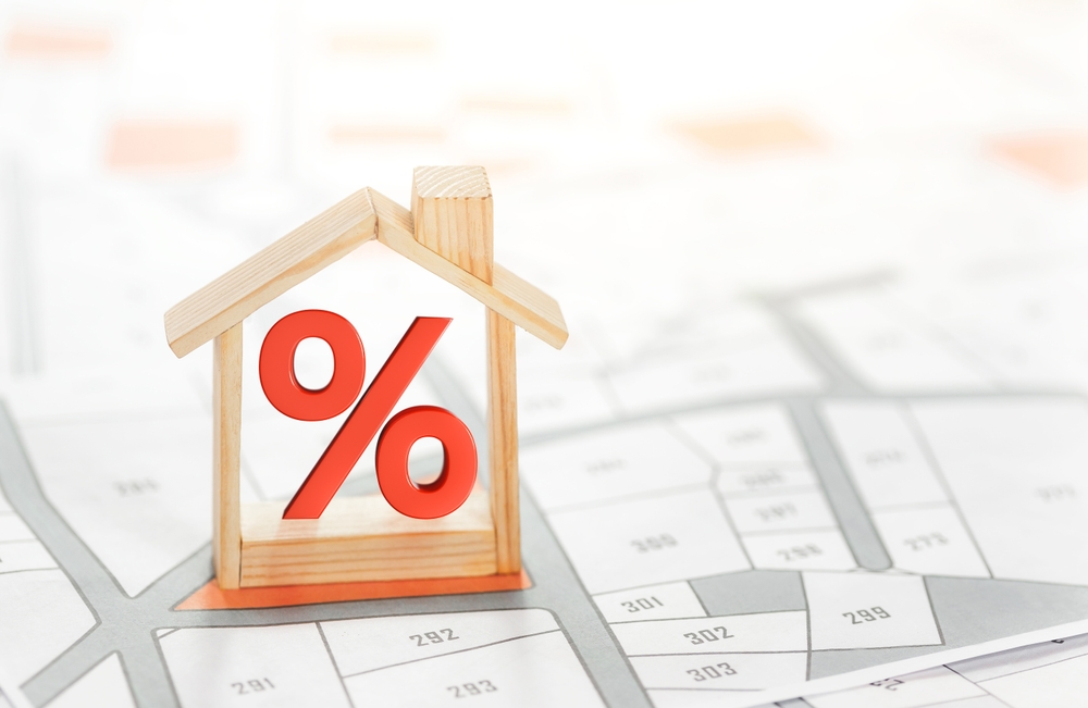 Base rate down but mortgages up